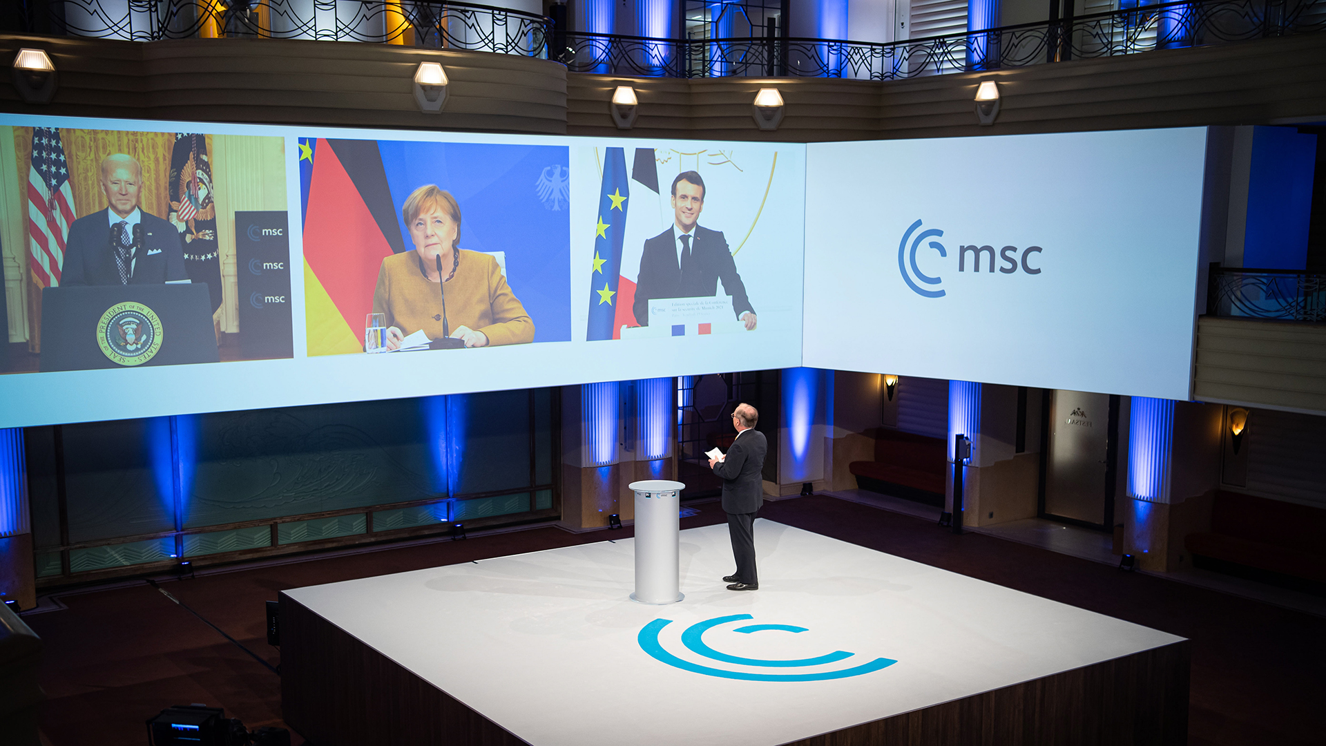 Biden, Merkel und Macron auf einem Monitor per Videokonferenz während der Sicherheitskonferenz | EPA