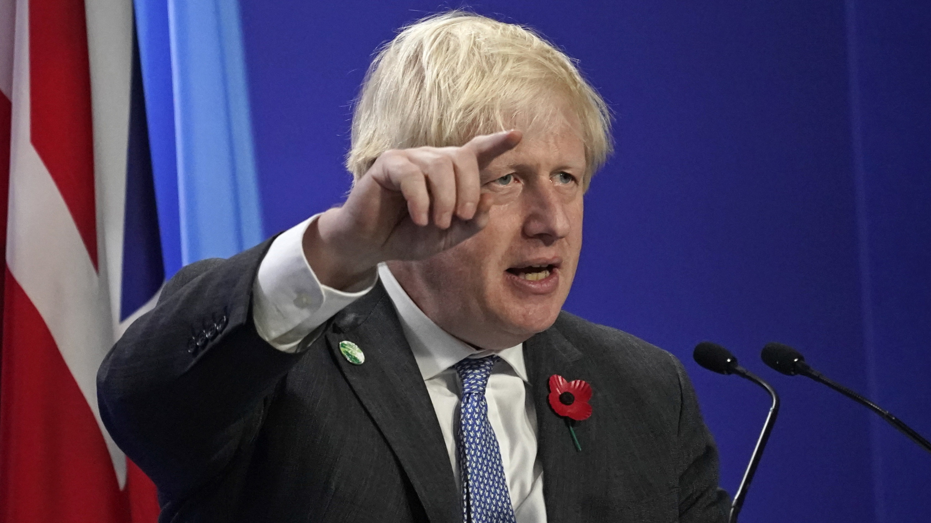 Boris Johnson gestikuliert bei einer Rede auf der Weltklimakonferenz in Glasgow. | AP