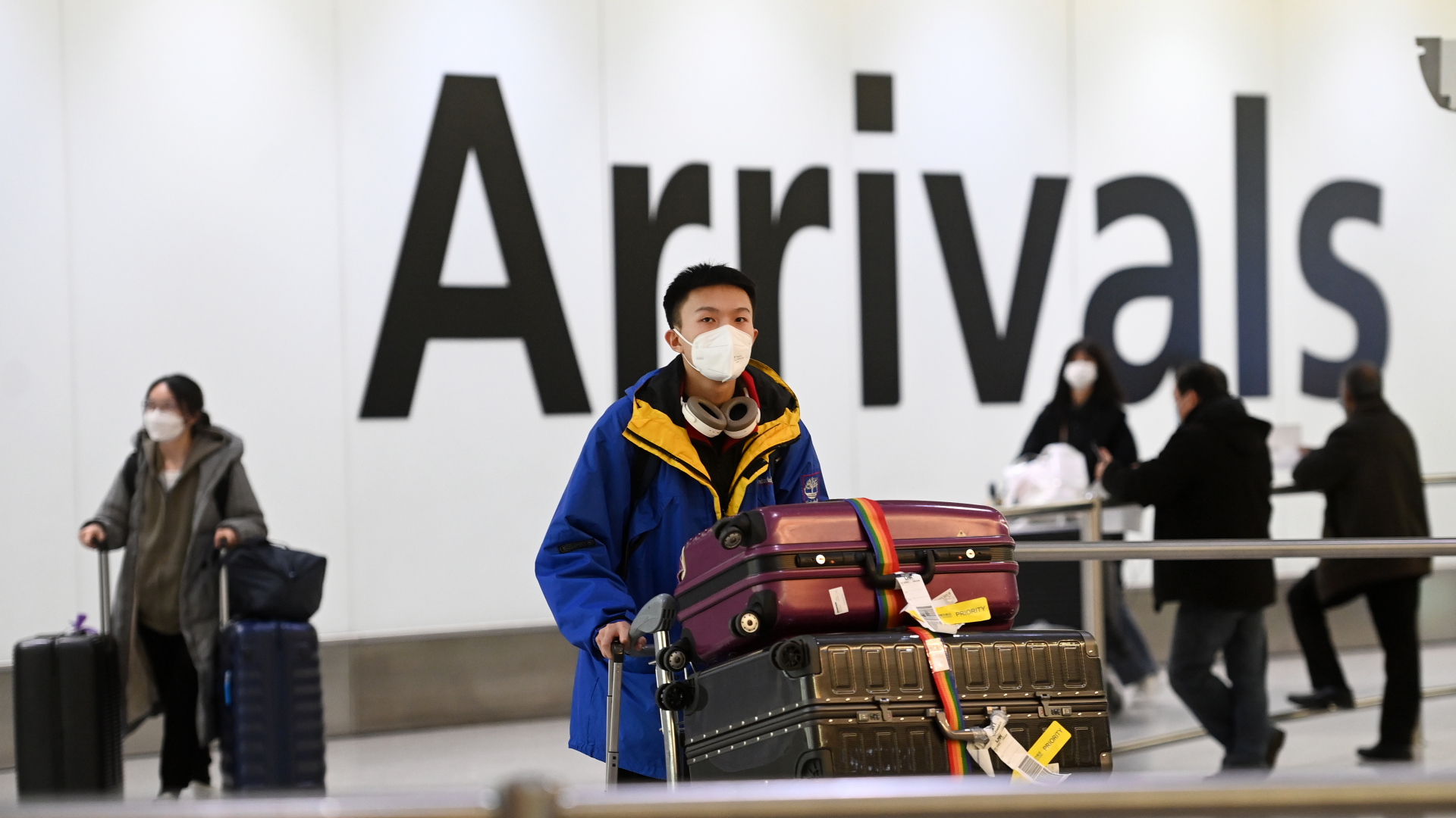 Menschen aus China bei der Einreise an Heathrow Airport in London | EPA