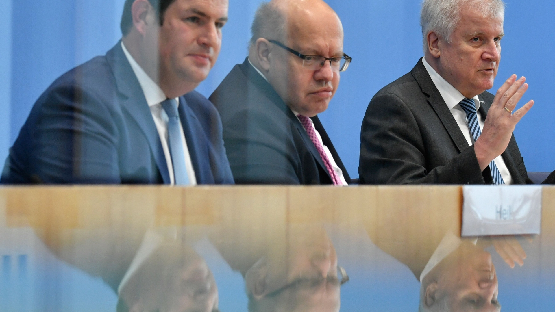 Einig drei Minister: Heil, Altmaier, Seehofer bei der Pl zum Einwanderungsgesetz | AFP