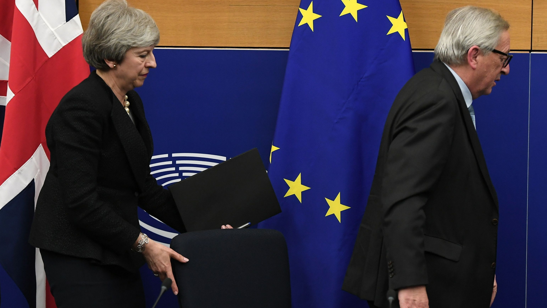 Theresa May and Jean-Claude Juncker | AFP