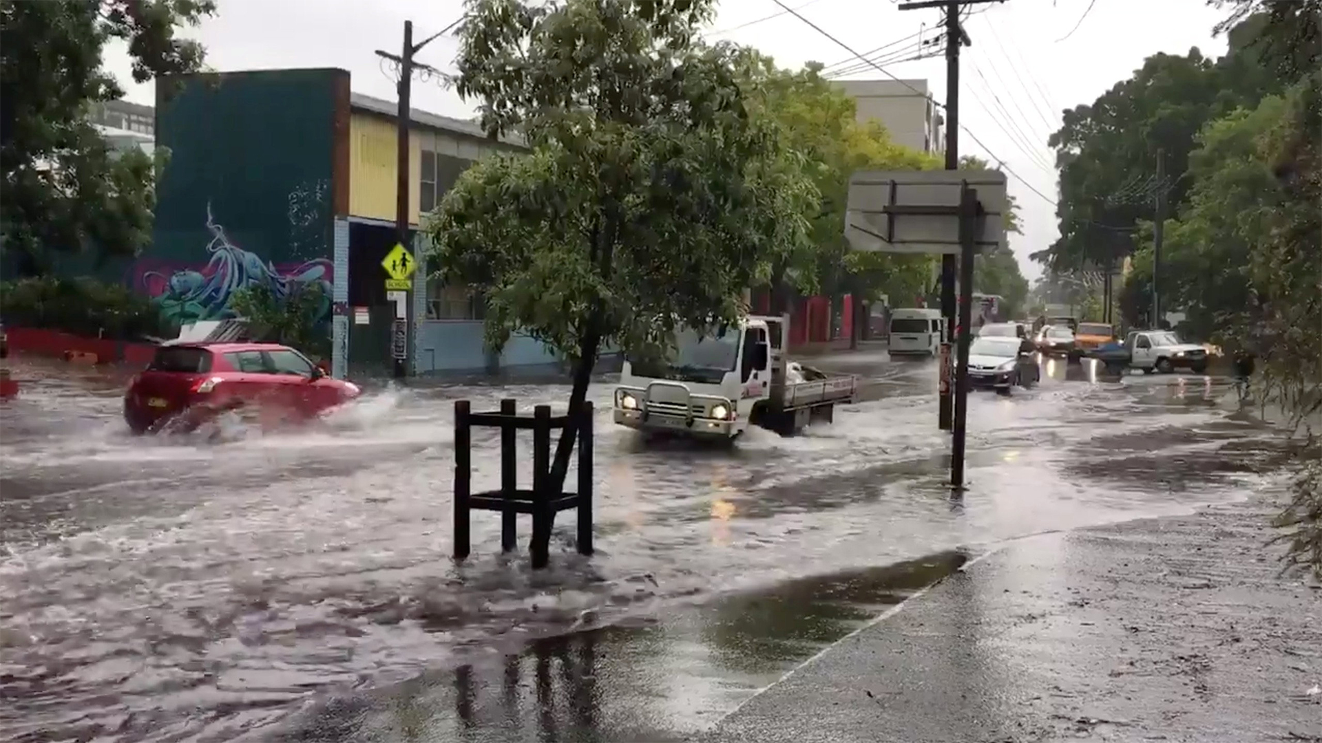 Eine überschwemmte Straße in Sydney | Bildquelle: REUTERS