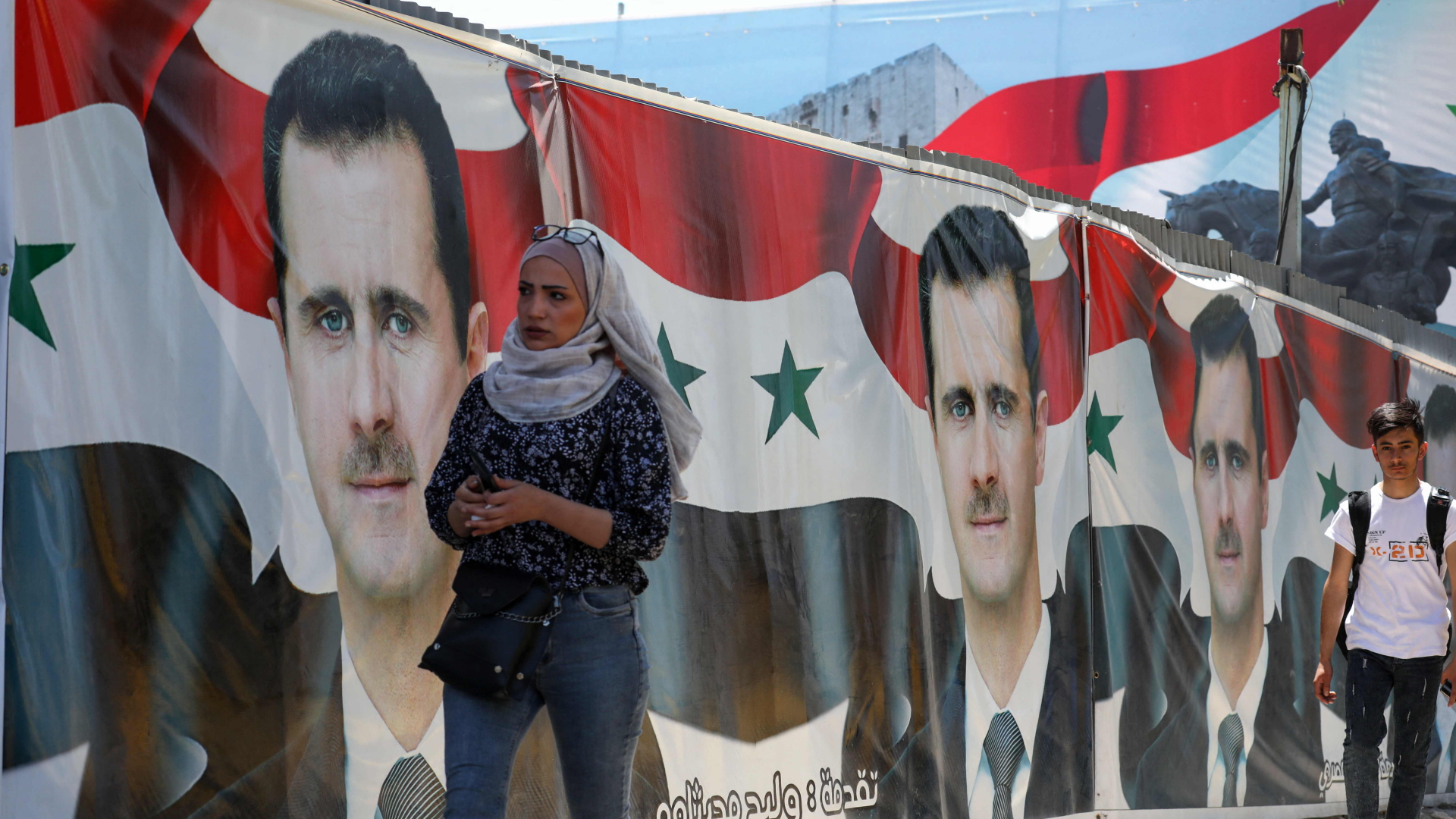 In Damaskus (Syrien) werben Plakate mit dem Konterfei des Präsidenten für die Wiederwahl Assads | AFP