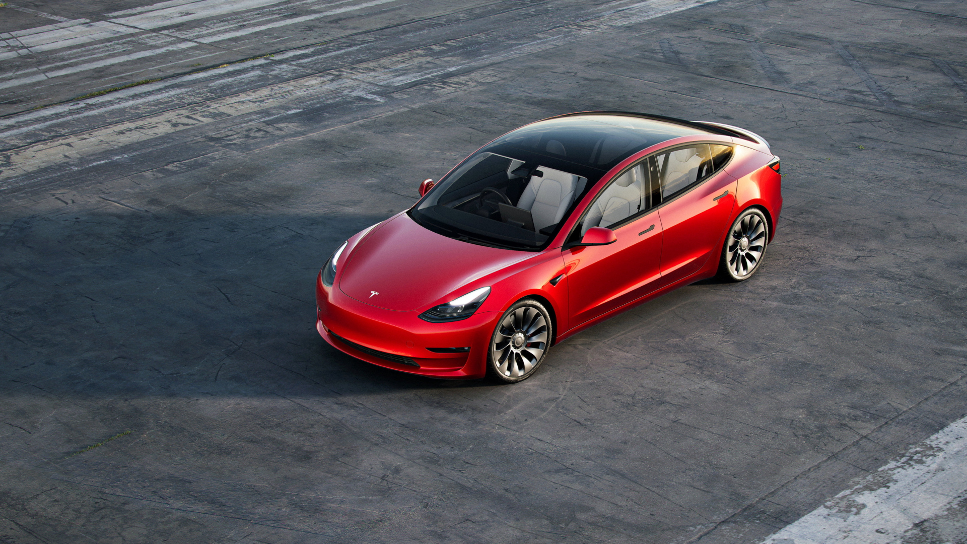 Ein Tesla Model 3 steht auf einem asphaltierten Platz | AP